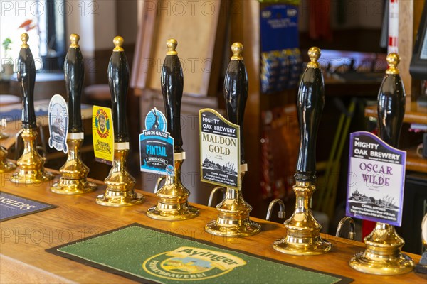 Line of cask beers real ales on bar at Stanford Arms pub