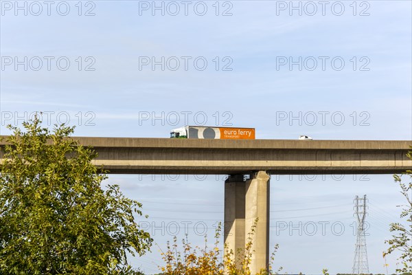 HGV truck lorry Euro Ferry vehicle driving on rasied section of Orwell Bridge