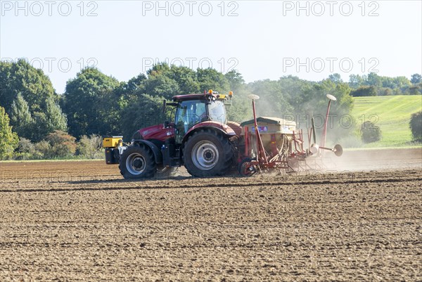 CASE 12 150 red tractor harrowing fiels