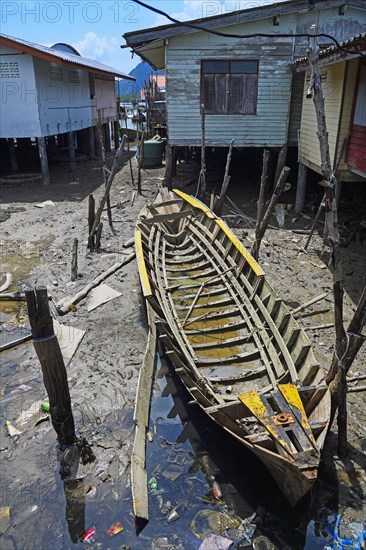 Old boat between the houses in the Muslim stilt village of Koh Panyi