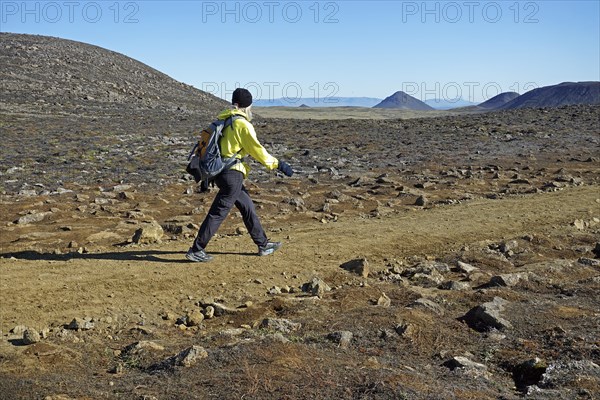 Hiker in volcanic landscape