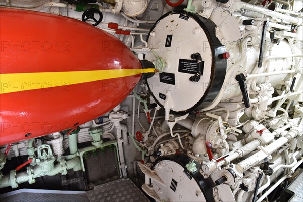 Torpedo in front of a torpedo shaft in a submarine in Kiel