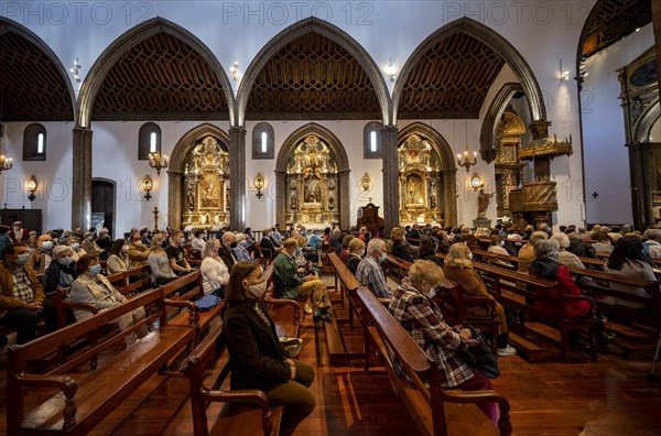 Interior with pews and gilded side altars