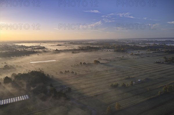 Aerial view of the Kirchwerder Wiesen nature reserve in Hamburg's Vier- und Marschlanden in the morning mist