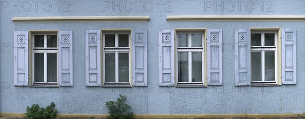 Window with shutters on a historic house