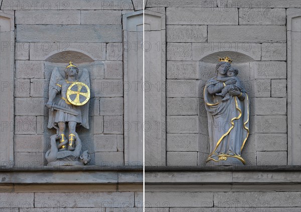 Sculpture of St. George with the dragon and Maria immaculata on a house facade c. 1850