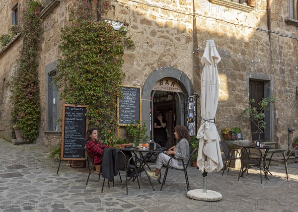 Two women at a street cafe