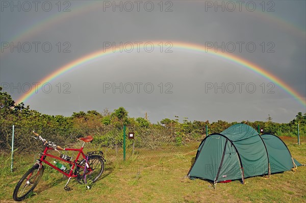 Bicycle and tent on a campsite