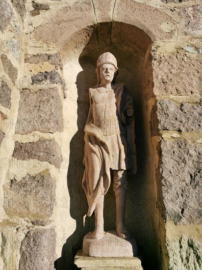 Stone figure on the facade