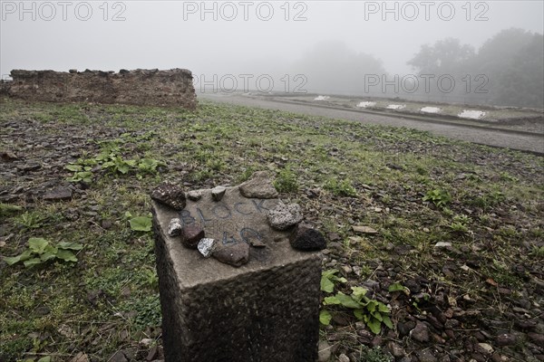 Memorial stone for camp barrack Block 40 at beech forest concentration camp