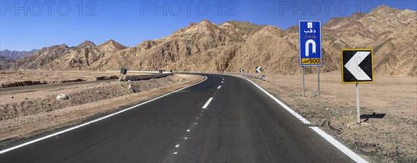 Road with signs for turning