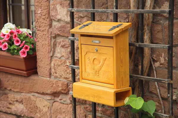 Decorative letterbox on a house wall in Michelstadt