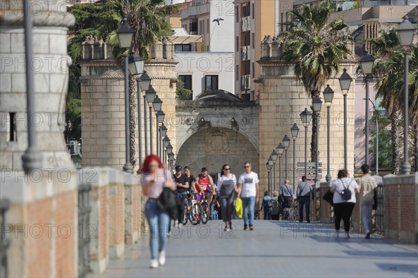 Lively people on the historic Puente de Palmas overlooking Puerta de Palmas in Badajoz