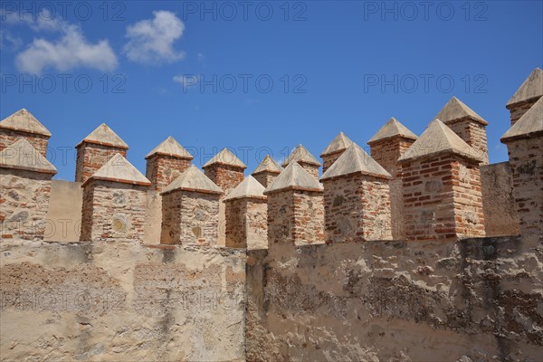 Detail with palisades at the city fortification Alcazaba in Badajoz