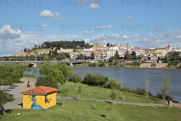 View over Parque del Guadiana with Rio Guadiana to cityscape with city fortress Alcazaba of Badajoz