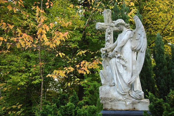 Angel with cross at the cemetery