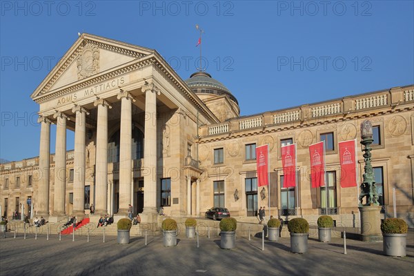 Neoclassical spa hotel with city flags in Wiesbaden