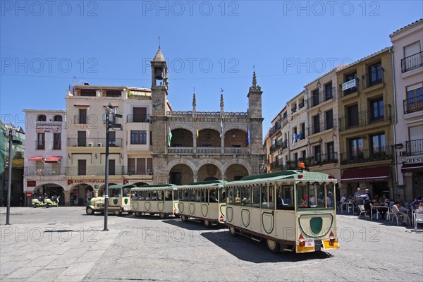 Plaza Mayor with tourist railway and town hall in Plasencia