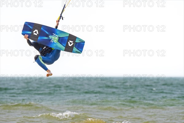Kitesurfing showing kiteboarder