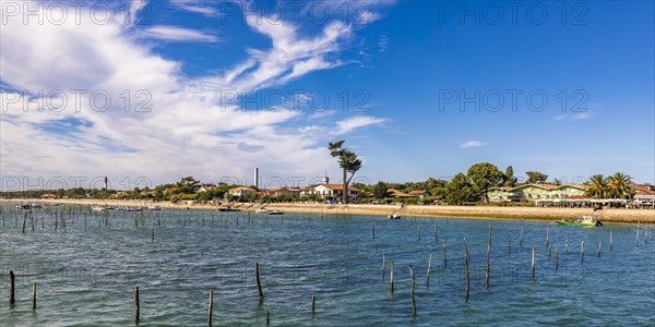 Village view with beach and lighthouse