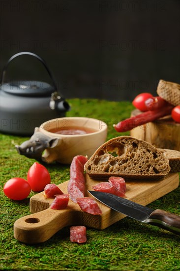 Snack on the moss with dried thin sausage