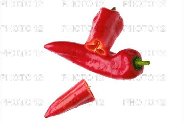 Top view of sweet capia pepper whole and cut on half isolated on white background