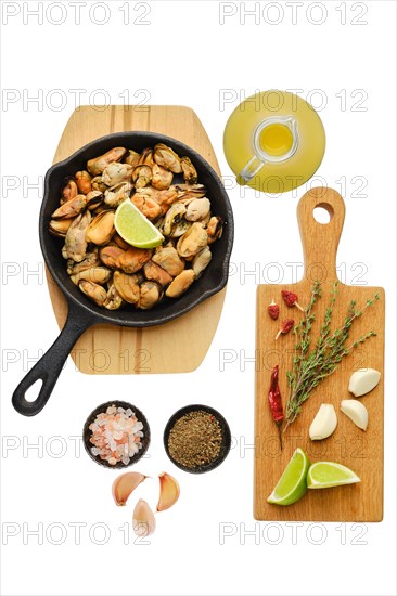 Boiled mussels and spice ready for frying isolated on white background