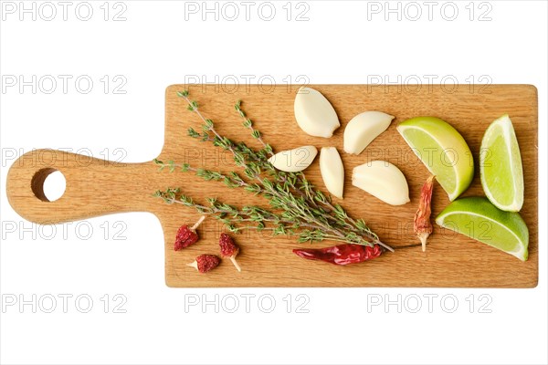 Top view of wooden cutting board with garlic