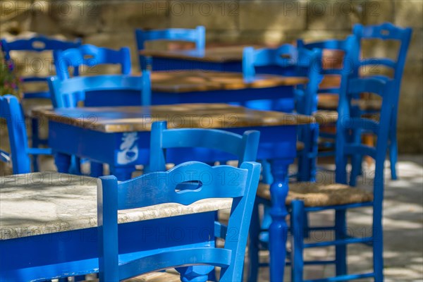Blue tables and chairs in a cafe