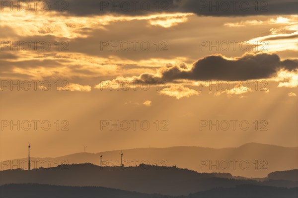 Wind turbines on the mountains of the Black Forest at dawn. Freiburg brisgau