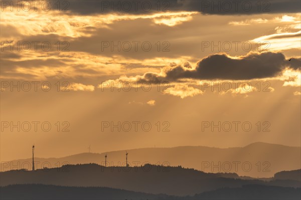 Wind turbines on the mountains of the Black Forest at dawn. Freiburg brisgau