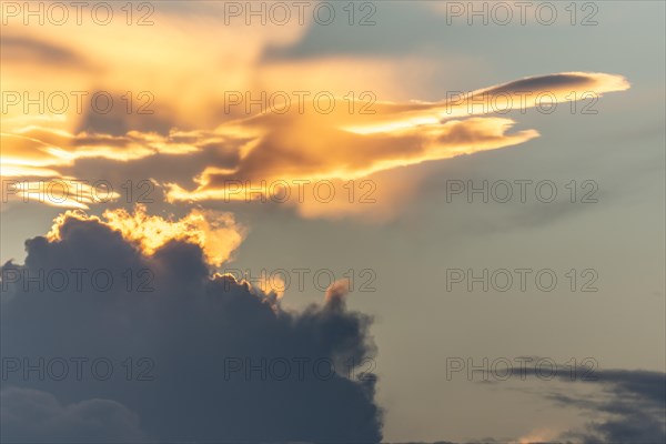 Sky of pink and orange clouds in the evening at sunset. Alsace