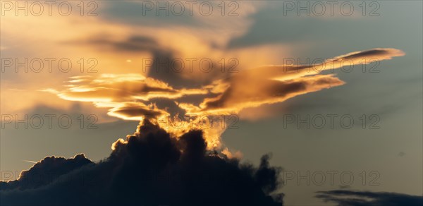 Sky of pink and orange clouds in the evening at sunset. Alsace