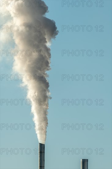 Column with smoke coming out of an industrial chimney. France