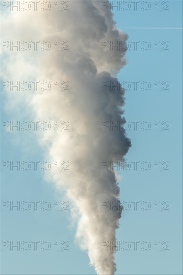 Column with smoke coming out of an industrial chimney. France