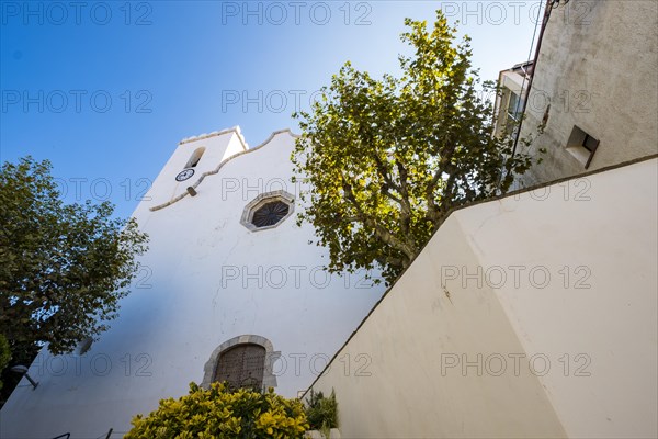 View of the facade of the church of the mother of ten snow in the center of the city of Port de la Selva in Cap de Creus north of the Costa Brava in Catalonia Spain