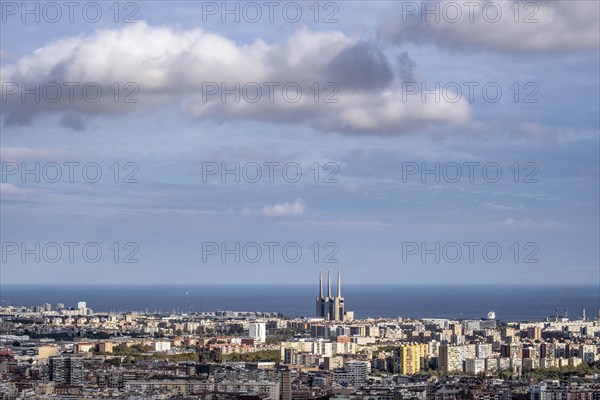 Aerial view of the city of Barcelona and in the background the chimneys of what used to be the Sant Adria thermal power plant