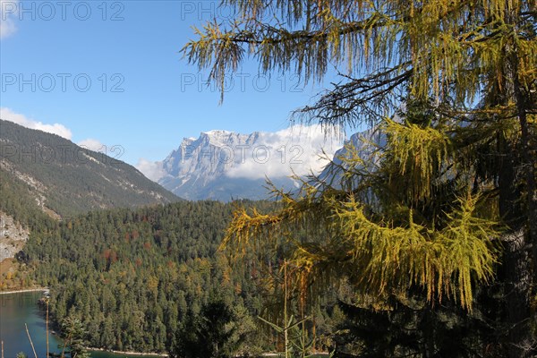 View of the Zugspitze massif with Blindsee lake in autumn