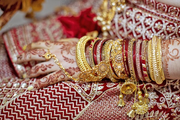 Traditional bridal jewelry and henna decoration on the hands of Hindu bride on her wedding day