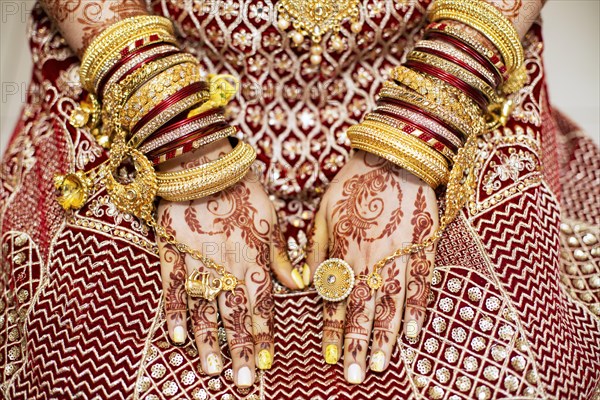 Traditional bridal jewelry and henna decoration on the hands of Hindu bride on her wedding day