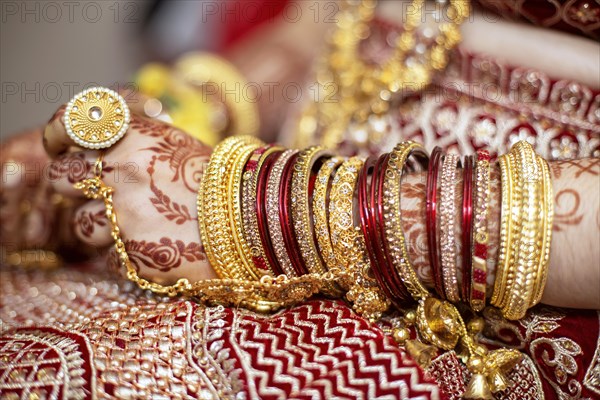 Traditional bridal jewelry and henna decoration on the hands of Hindu bride on her wedding day