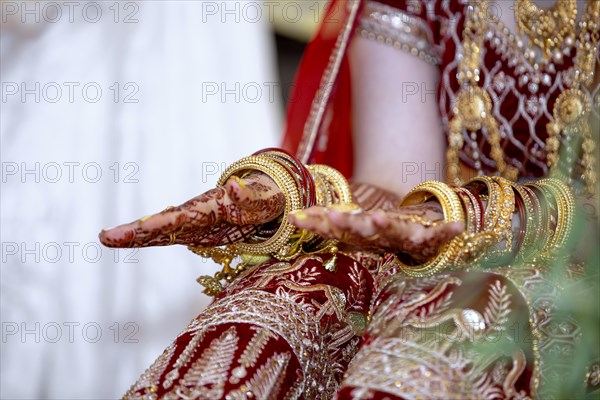 Traditional bridal jewelry and henna decoration on the hands of Hindu bride on her wedding day