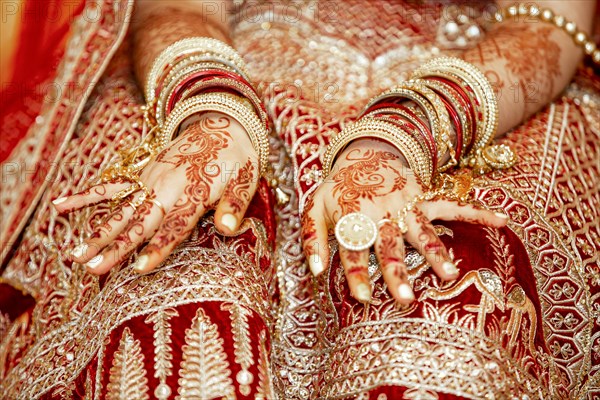 Traditional bridal jewelry and henna decoration on the hands of Hindu bride on her wedding day