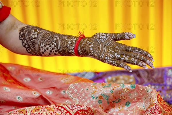 Beautiful henna design on the hand of a Hindu bride on her wedding eve