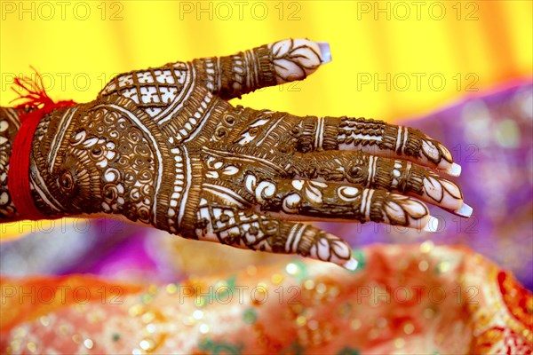 Beautiful henna design on the hand of a Hindu bride on her wedding eve