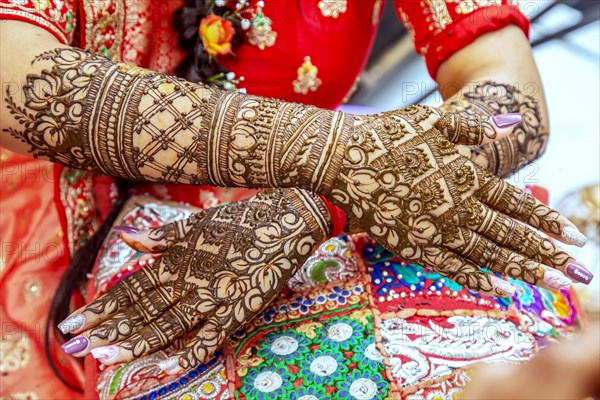 Beautiful henna design on the hand of a Hindu bride on her wedding eve