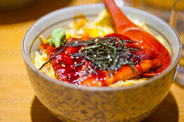 Traditional Japanese ramen noodles with unagi eel on top