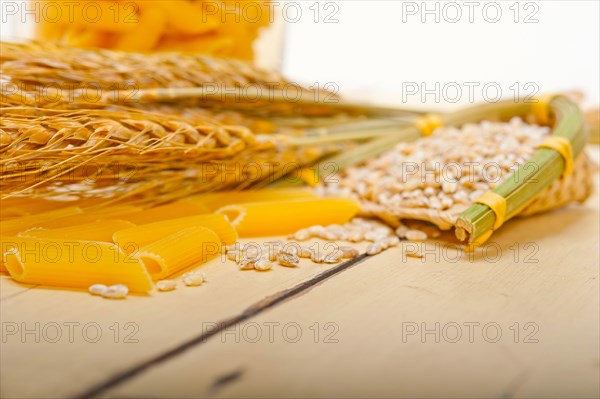 Short Italian pasta penne with durum wheat grains