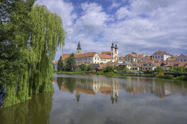 View over a pond to the old town of