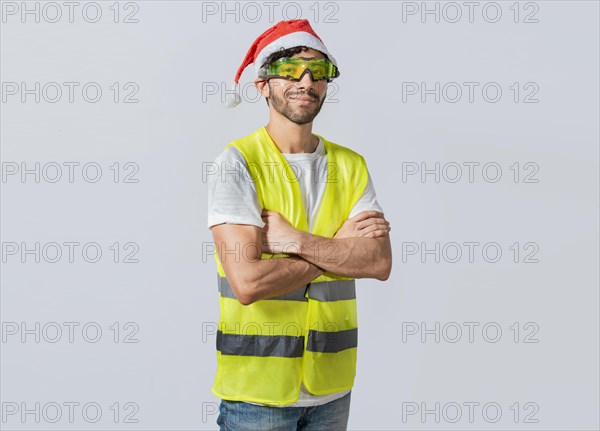Portrait of a smiling engineer in a christmas hat